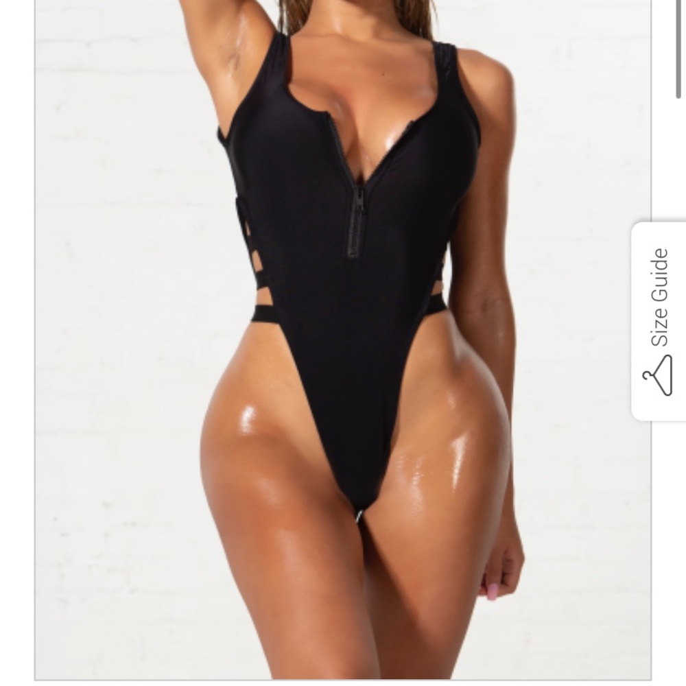 Black strappy one piece and blue tie dye bikini